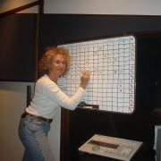 Updating a track on the production board. Photo by Rudy Guess